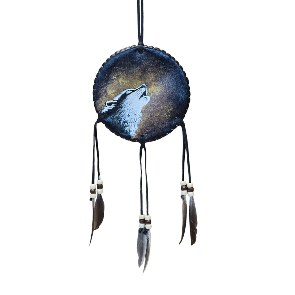 Hand Painted Leather Dream Catcher Featuring a Howling Wolf & Adorned with Leather Feathers and Beads.