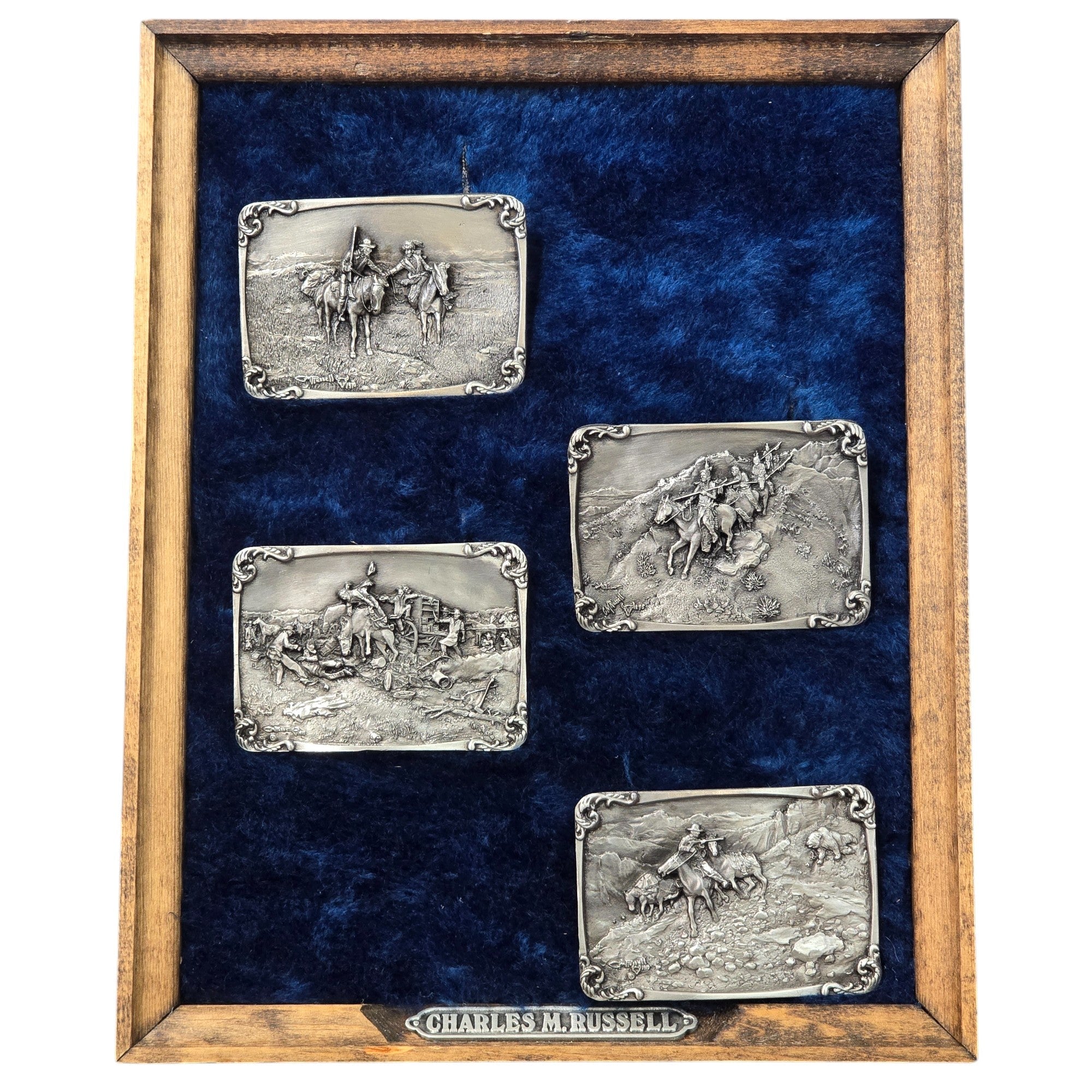 Charles M. Russell, Limited Edition Belt Buckles, Set of Four #3136 of 5000